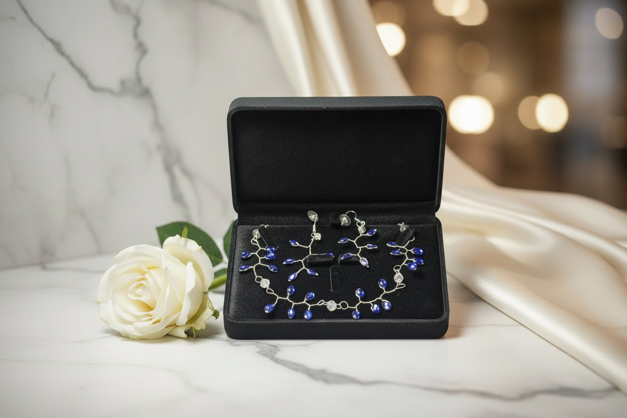 Jewelry set with necklace and earrings in a black velvet box.